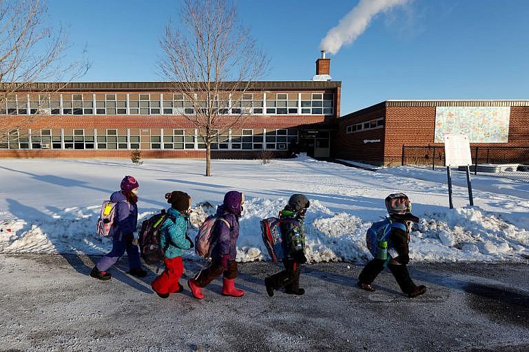 Students return to in-class learning after a four-week lockdown at Vincent Massey Public School in Ottawa, on Feb. 1, 2021 (Blair Gable/Reuters)
