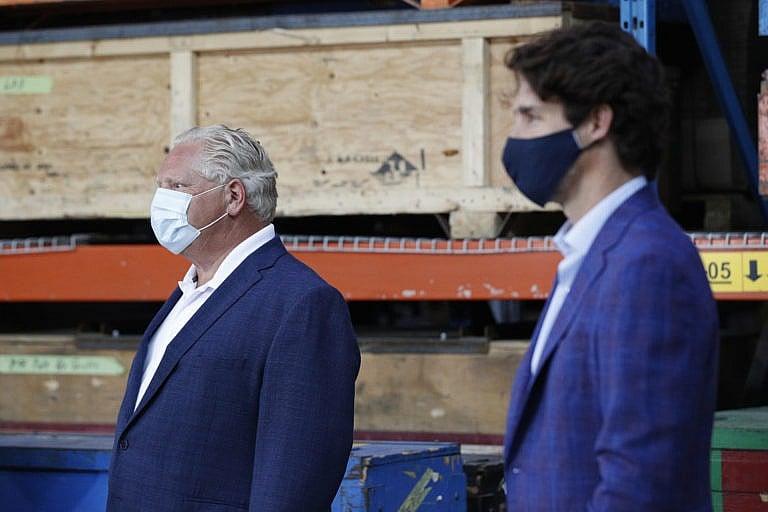 Ford and Trudeau make an announcement at a 3M plant in Brockville, Ont., on Aug. 21, 2020 (CP/Lars Hagberg)