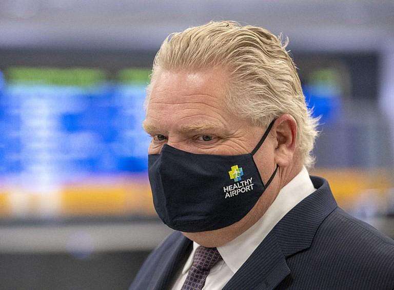 Ontario Premier Doug Ford tours the COVID-19 testing centre in Terminal 3 at Pearson Airport in Toronto on Wednesday, February 3, 2021. THE CANADIAN PRESS/Frank Gunn