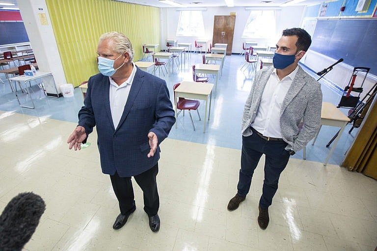 Ontario Premier Doug Ford, left, and Education Minister Stephen Lecce take a tour of Kensington Community School to see the measures implemented as students return to school amidst the COVID-19 pandemic on Tuesday, September 1, 2020. THE CANADIAN PRESS/Carlos Osorio