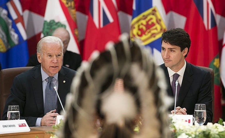 U.S. Vice President Joseph "Joe" Biden, left, speaks as Justin Trudeau, Canada's prime minister, listens during a First Ministers Meeting in Ottawa, Ontario, Canada, on Friday, Dec. 9, 2016. Visiting Ottawa before he leaves office, the vice-president called on Trudeau -- who is beginning his second year in power -- to set an example on the international stage. Photographer: Chris Roussakis/Bloomberg via Getty Images