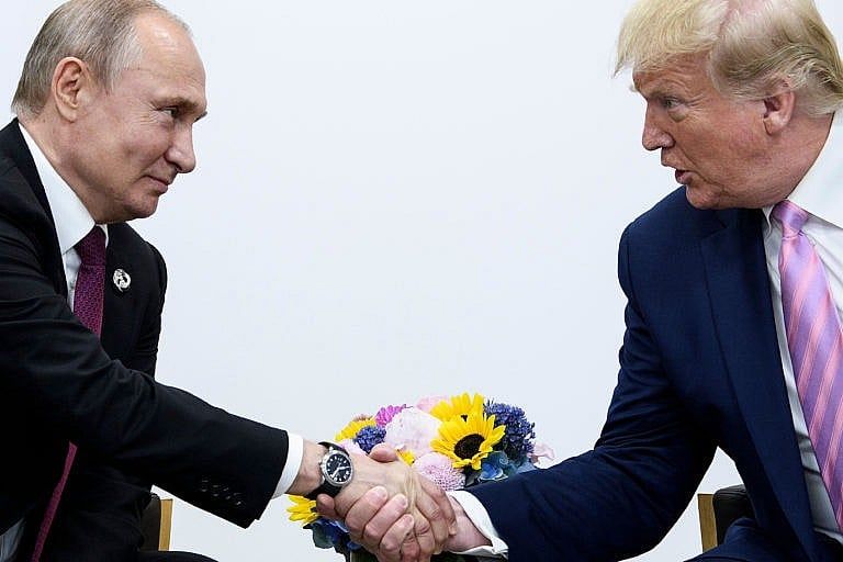 Russia's President Vladimir Putin with U.S. President Donald Trump with during the G20 summit in Osaka on June 28, 2019 (Brendan Smialowski/AFP/Getty Images)