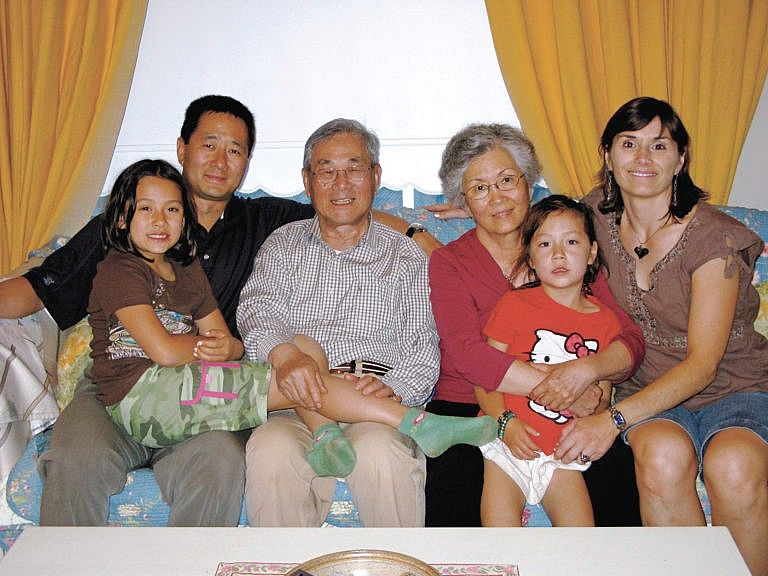 Nai Nai (third from right) and the author (far right) with their family (Courtesy of Ingrid Littmann-Tai)