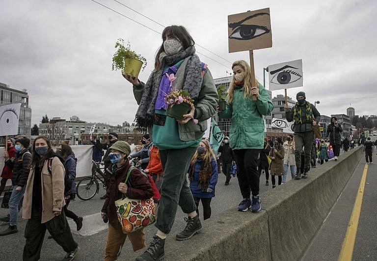 People march during a climate change protest in Vancouver on March 27, 2021 (Liang Sen/Xinhua via ZUMA Press)