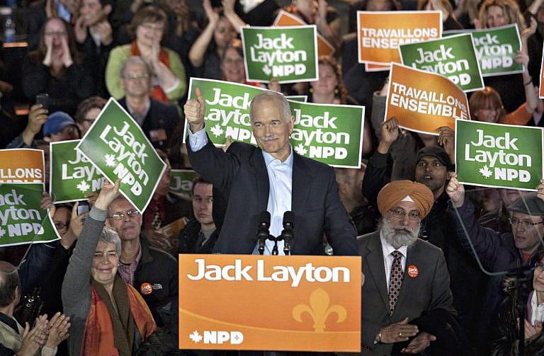 Layton gives the thumbs up to supporters in Montreal at a rally on April 23, 2011 (CP/Jacques Boissinot)