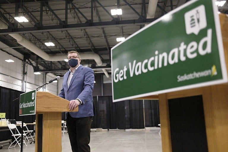 Scott Moe, the Saskatchewan premier, speaks to media in February after a tour of a COVID-19 mass immunization clinic. (Michael Bell/CP)