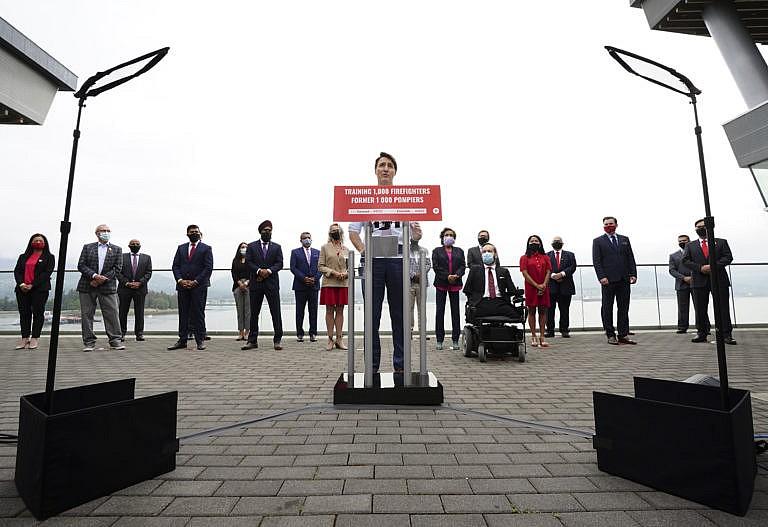 Liberal Leader Justin Trudeau holds a campaign event in downtown Vancouver, B.C., on Wednesday, Aug 18, 2021. He is backdropped by Liberal candidates. THE CANADIAN PRESS/Sean Kilpatrick