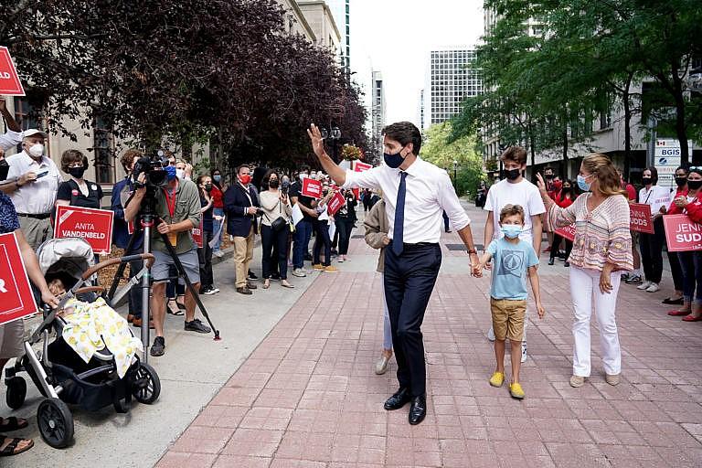 Liberal Party Leader Justin Trudeau greets a crowd of supporters with his family in tow after triggering a federal election, in Ottawa, Sunday, Aug. 15, 2021. THE CANADIAN PRESS/Sean Kilpatrick