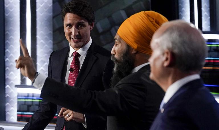 Liberal Leader Justin Trudeau, left to right, NDP Leader Jagmeet Singh, and Conservative Leader Erin O'Toole take part in the federal election English-language Leaders debate in Gatineau, Que., on Thursday, Sept. 9, 2021. THE CANADIAN PRESS/Adrian Wyld