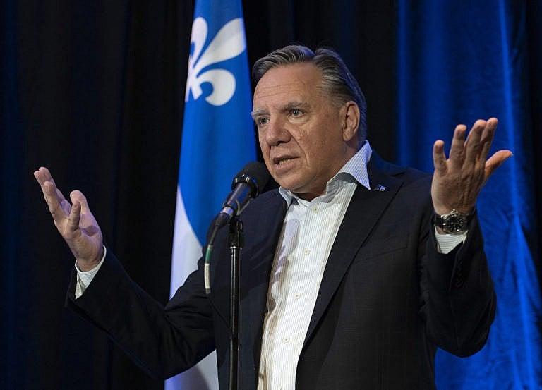 Quebec Premier Francois Legault responds to reporters questions over the federal election debate, before entering a pre-session party caucus Thursday, September 9, 2021 in Quebec City. (Jacques Boissinot/CP)