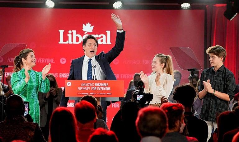 Canada's Liberal Prime Minister Justin Trudeau, accompanied by his wife Sophie Gregoire and their children Ella-Grace and Xavier, waves to supporters during the Liberal election night party in Montreal, Quebec, Canada, September 21, 2021. (Carlos Osorio/Reuters)