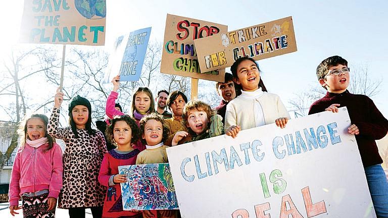 Children holding climate change signs