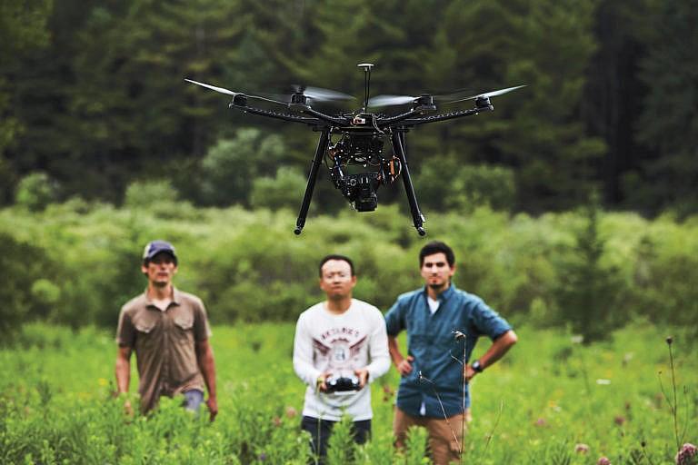 Drones, like the ones used by Carleton’s Dr. Murray Richardson (left), can help collect data for species conservation and habitat modelling (Courtesy of Carlton University)