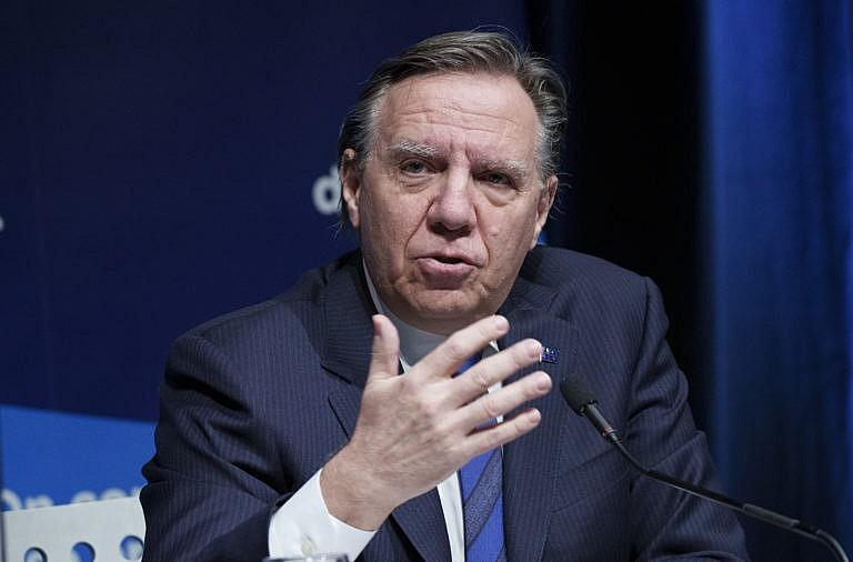 Legault responds to a question during a news conference in Montreal, Jan. 11, 2022. (Paul Chiasson/The Canadian Press)