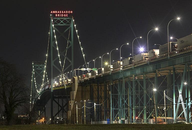 Trucks are lined up on the Ambassador Bridge between Windsor and Detroit, Michigan, Dec. 18, 2021. (Fred Thornhill/The Canadian Press)