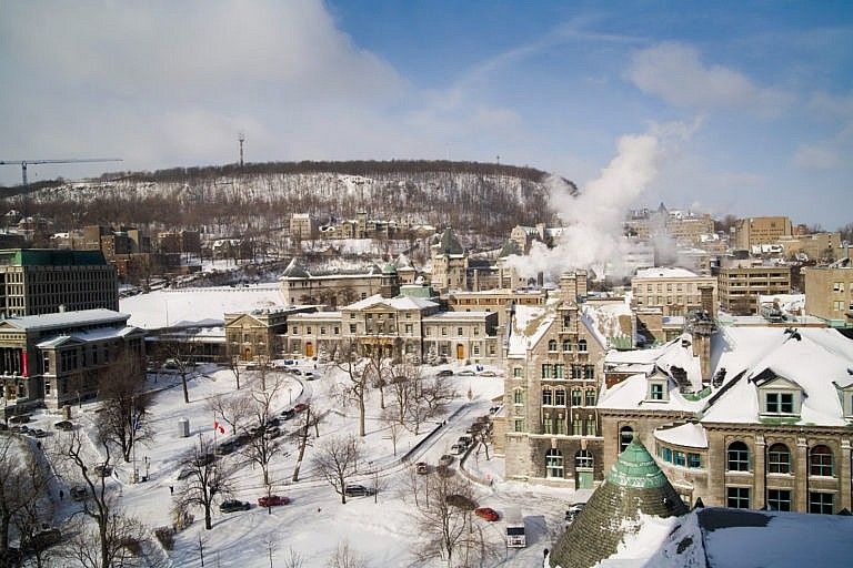 Overhead, wide-angle shot of a university buildings covered in snow